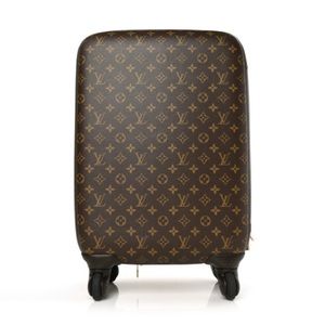 Louis Vuitton roller luggage. Comes with travel brown cover and tag